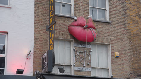 Sculpted-Advertising-Display-Of-Lips-On-Outside-Of-Store-Buildings-In-Camden-North-London-UK
